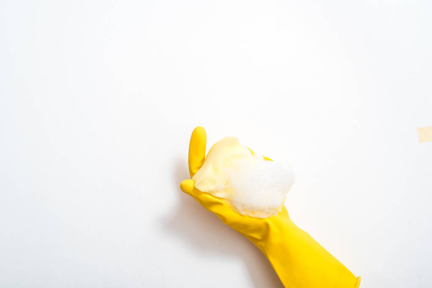 One hand in rubber glove isolated on white background - 写真・画像