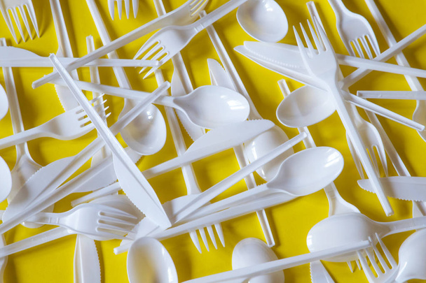 Plastic disposable cutlery, forbidden in European Union. - Fotoğraf, Görsel