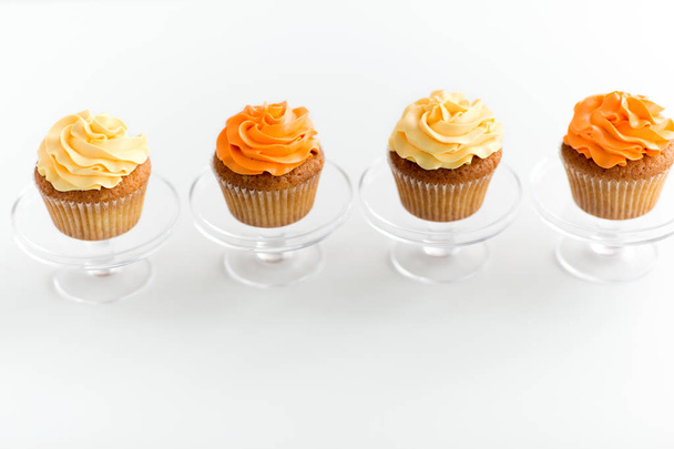 cupcakes with frosting on confectionery stands - Foto, immagini