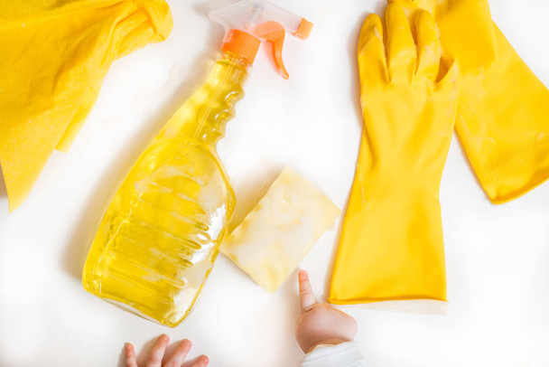 Cleaning concept - mixed detergents and cleaning accessories isolated on blue seamless background. - Valokuva, kuva