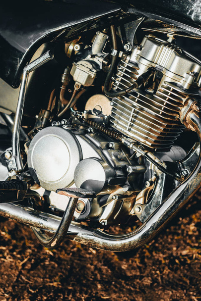 motorcycle. the main part of the engine. there is dirt on it. close-up. there is toning. - Photo, Image