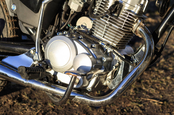 motorcycle. the main part of the engine. there is dirt on it. close-up. there is toning. - Photo, Image