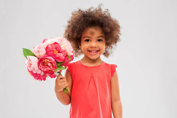 happy little african american girl with flowers - Photo, Image