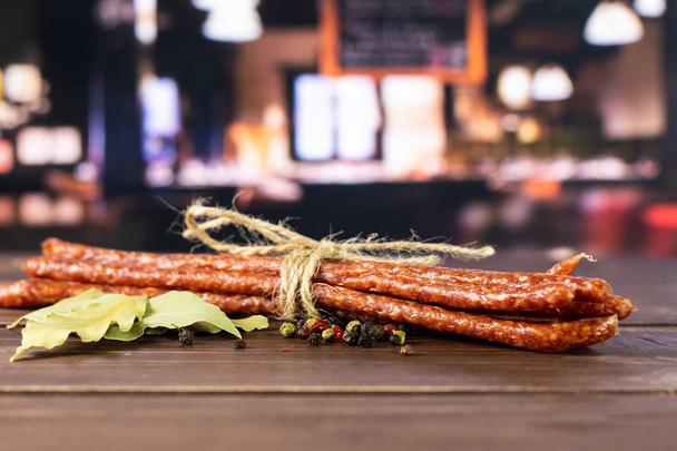 Spicy tyrolini salami stick in a restaurant - Фото, изображение