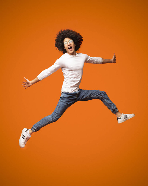 Funny young black man walking on air - Photo, Image