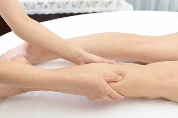 Close-up of leg receiving massage in spa - Foto, Imagem