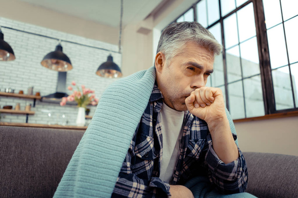 Cheerless unhappy man suffering from strong cough - Photo, Image