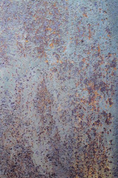 Background texture of old rusty damaged metal. Remains of multi-colored paint on an iron sheet. - Photo, Image