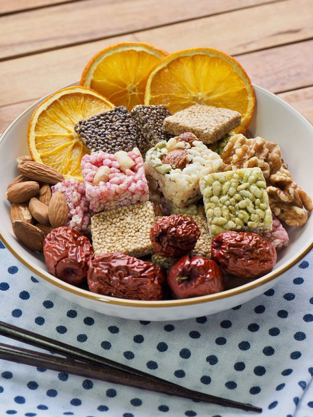 Korean traditional snacks SweetRicePuffs, Gangjeong and Nuts and Dried Orange and Jujube - Photo, Image