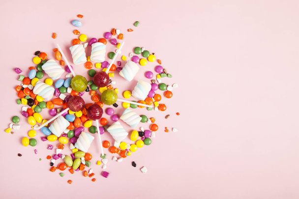 Colorful lollipops and different colored round candy. Top view. - Fotó, kép