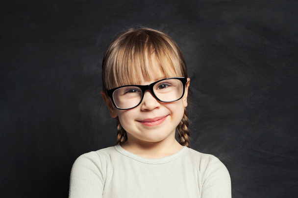 Portrait of funny cute child on school classroom background - Photo, Image