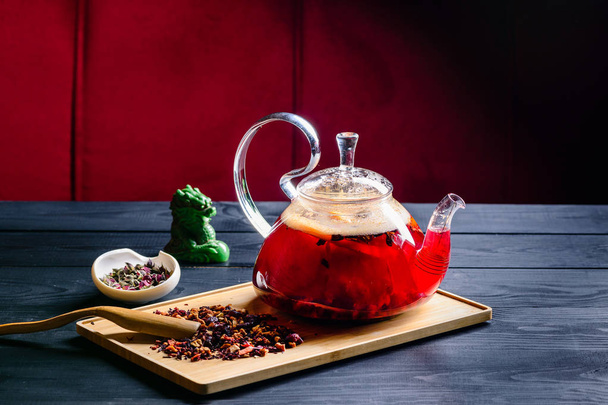 red tea in a glass teapot, tea ceremony - Фото, изображение