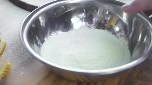 Pouring flour in kitchen machine for kneading dough for pizza or pasta in italian cuisine. Cook pouring flour in electric mixer for knead dough at bakery. Preparing bread and cake in kitchen machine. - Filmmaterial, Video