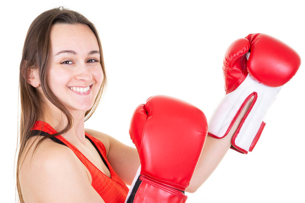 Strong woman in boxing gloves on white background - 写真・画像