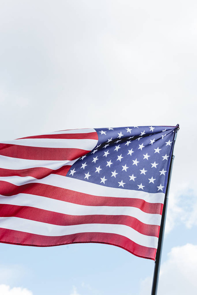 national flag of america with stars and stripes against sky - Zdjęcie, obraz