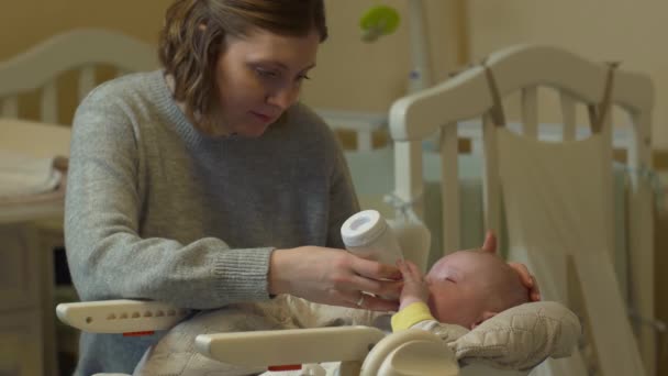 Mother Feeds Baby Bottle - Footage, Video