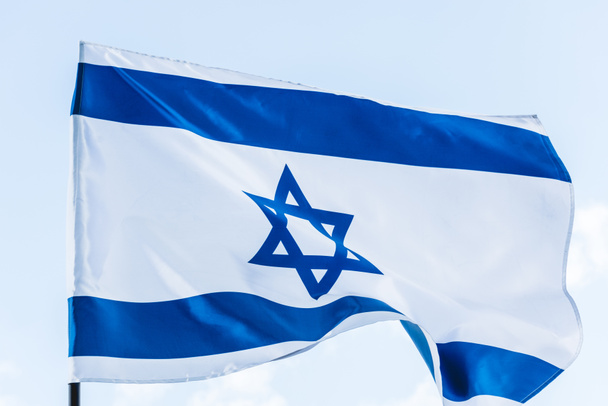 national flag of israel with star of david against sky  - Foto, immagini