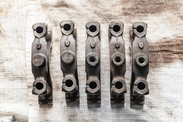Engine connecting rods and pistons used and removed from a four- - Photo, Image