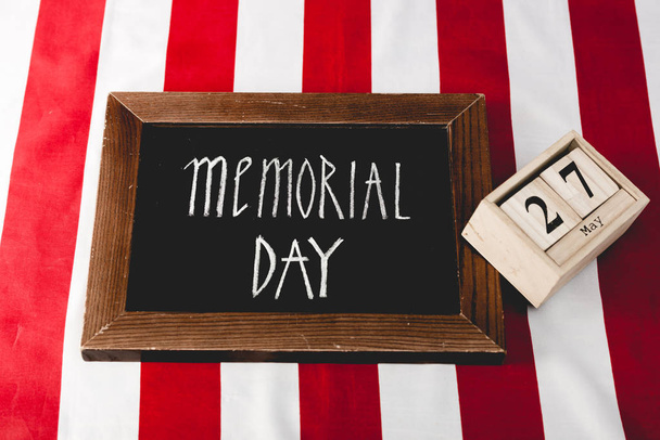 memorial day letters on black board near wooden cubes with date  - Foto, immagini