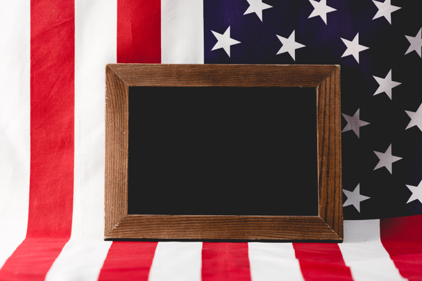 empty chalkboard near national flag of america  - Фото, зображення