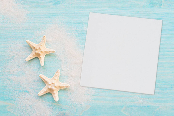 Starfishes and white paper - Foto, afbeelding