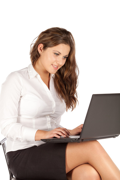 Charming young businesswoman with laptop - Fotó, kép