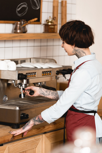 selective focus of pretty barista preparing coffee on espresso machine - Photo, Image