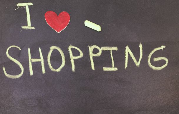 I love shopping phrase handwritten on the  blackboard with red heart - Photo, Image