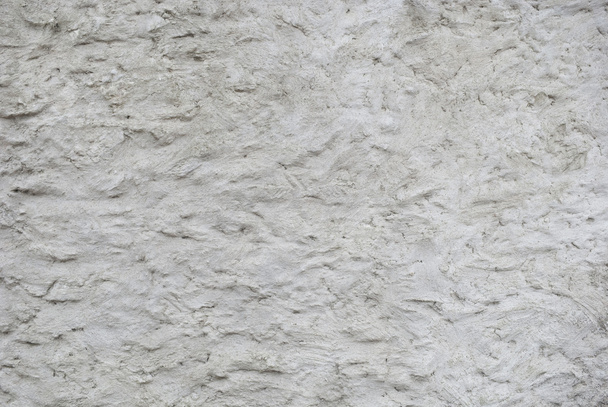 Текстура серой грубо оштукатуренной стены
 - Фото, изображение