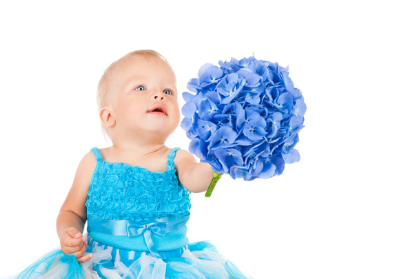 Little girl with a bouquet of blue hydrangeas - Foto, imagen