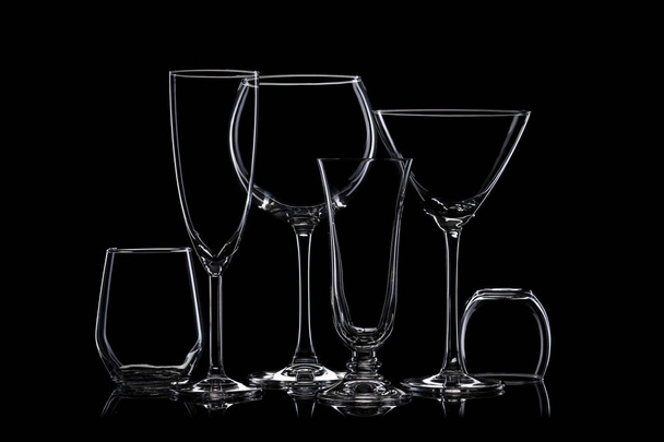 Glassware silhouettes on black. - Foto, Imagen