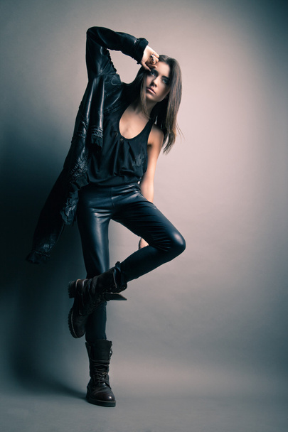Fashion model wearing leather pants and jacket - Fotoğraf, Görsel