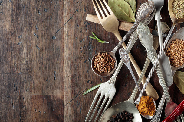 Various herbs and spices on wooden table. - Photo, Image