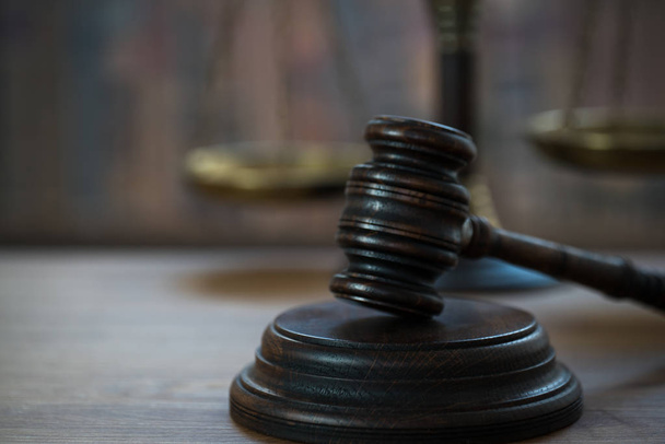 Huge judge's wooden gavel on blurred background - Foto, afbeelding