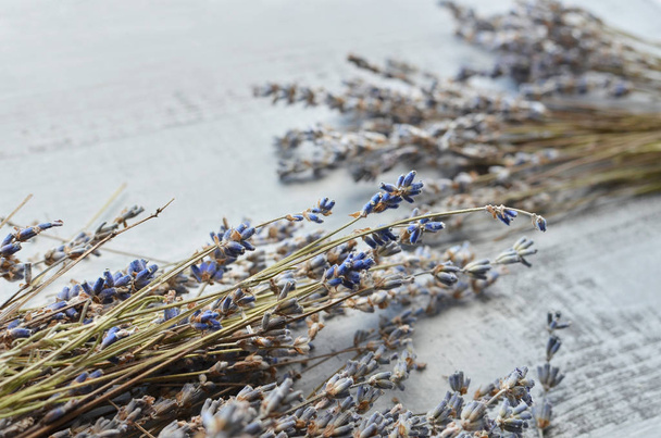 dry lavender flowers on a wooden board - Zdjęcie, obraz