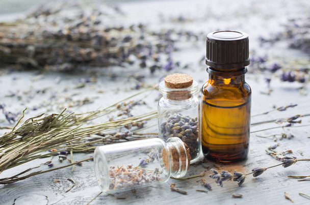 lavender essential oil with lavender on wooden background - Zdjęcie, obraz