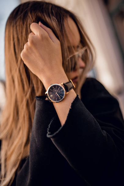 Beautiful black watch on woman hand - Фото, зображення