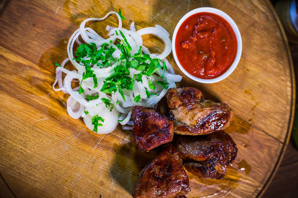 Barbecue skewers with juicy meat and sauce on plate, closeup - Fotografie, Obrázek