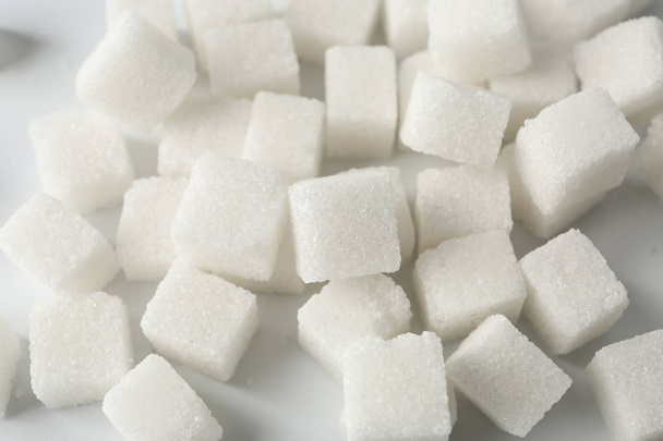 Sugar cubes on white background - Foto, imagen