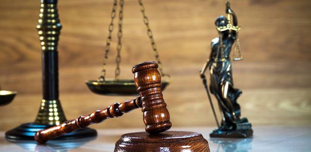 Huge judge's wooden gavel on blurred background - Photo, Image