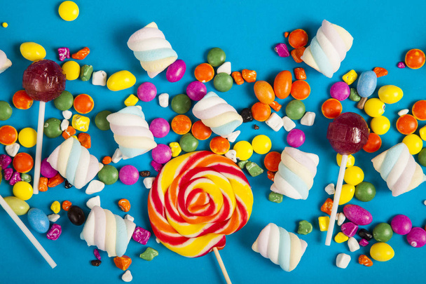 Colorful lollipops and different colored round candy. Top view. - Foto, Imagem