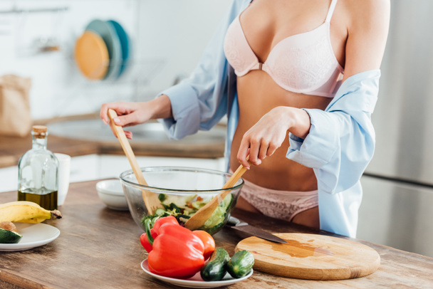 Cropped view of sexy girl in underwear and shirt cooking vegetable salad - Φωτογραφία, εικόνα