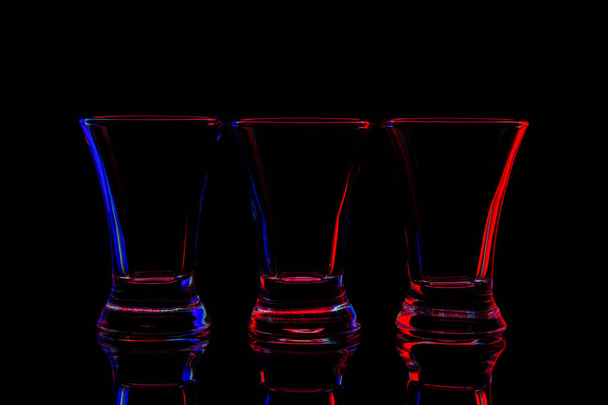 shots with colored edges on a black background. - Photo, Image