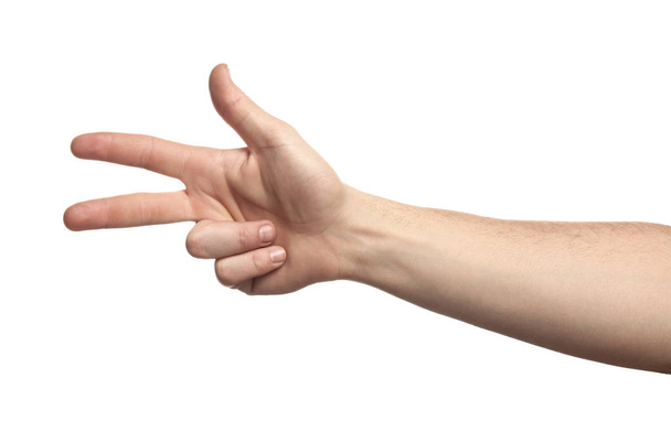 Mano masculina mostrando dos dedos sobre fondo blanco
 - Foto, imagen