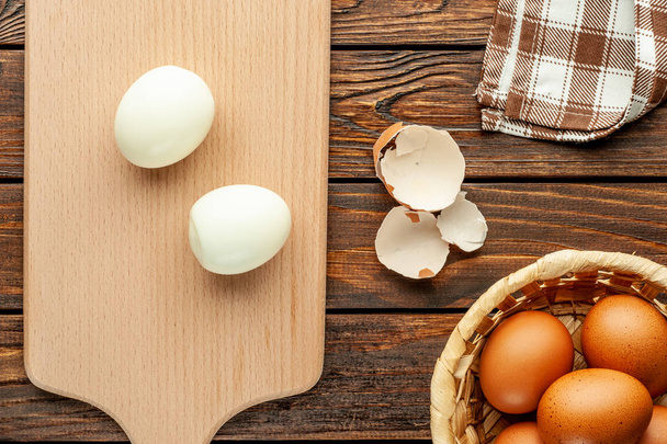 Peeled boiled egg on wooden background.  - Photo, Image
