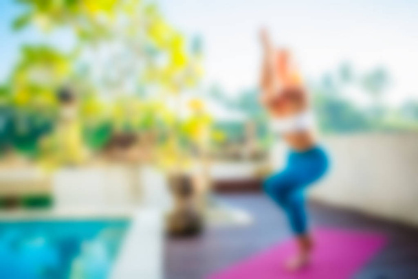 Yoga at Bali Indonesia Travel theme blur background - Fotografie, Obrázek