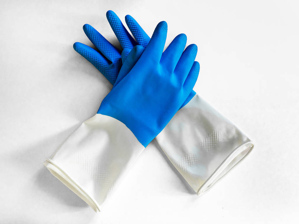 pair of nitrile blue gloves isolated on white background. Closeup top view. housework concept. General or regular cleanup. Commercial cleaning company - Valokuva, kuva