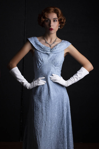 Glamorous 1930's woman in a blue dress - 写真・画像
