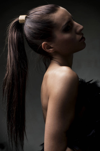 Beautiful young girl, with ponytail, in shallow focus, artistic - Photo, Image