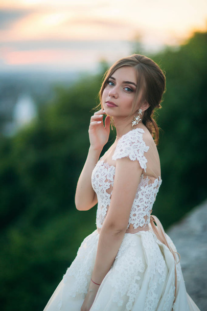 Elegant lady in white dress. Young model in evening dress - Photo, image